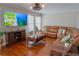 Inviting living room featuring a modern ceiling fan and bright natural light at 5713 Brynwood Nw Cir, Acworth, GA 30101