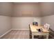 Bright office with a large skylight, neutral walls and carpets, a wooden desk and a comfortable chair at 5713 Brynwood Nw Cir, Acworth, GA 30101