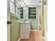Bright bathroom with built-in shelves, updated vanity, and ample lighting above the sink at 622 Jockey Ln, Auburn, GA 30011