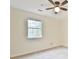 Bedroom with neutral walls, carpet, ceiling fan, and a bright window at 622 Jockey Ln, Auburn, GA 30011