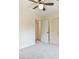 Bedroom with neutral walls, carpet, ceiling fan, and white doors at 622 Jockey Ln, Auburn, GA 30011