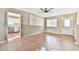 Open-concept living space with hardwood floors, connecting to the kitchen and other areas at 622 Jockey Ln, Auburn, GA 30011