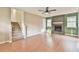 Inviting living room with hardwood floors, stairs and a brick fireplace offering ample space at 622 Jockey Ln, Auburn, GA 30011