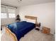 A comfortable bedroom featuring neutral carpet and bright natural light at 3875 Ivy Run Cir, Duluth, GA 30096