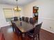 Traditional dining room with hardwood floors and decorative chandelier at 3875 Ivy Run Cir, Duluth, GA 30096