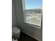 Bathroom featuring a toilet and a window providing natural light and neighborhood views at 390 River Walk Farm Parkway Lot 47, Covington, GA 30014