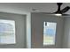 Bedroom featuring ceiling fan and two windows at 390 River Walk Farm Parkway Lot 47, Covington, GA 30014