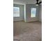 Comfortable carpeted bedroom with bright natural light coming in from two windows at 390 River Walk Farm Parkway Lot 47, Covington, GA 30014