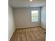Neutral carpet in bedroom with window view at 390 River Walk Farm Parkway Lot 47, Covington, GA 30014