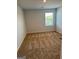 Bedroom featuring neutral walls, carpet, and a window at 390 River Walk Farm Parkway Lot 47, Covington, GA 30014