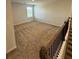 Upstairs bonus room with neutral carpet at 390 River Walk Farm Parkway Lot 47, Covington, GA 30014