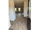 Inviting entryway with wood-look flooring leading to the staircase and living area, offering a seamless transition at 390 River Walk Farm Parkway Lot 47, Covington, GA 30014
