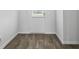 Entryway featuring modern white front door and luxury vinyl plank flooring at 390 River Walk Farm Parkway Lot 47, Covington, GA 30014