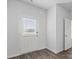 Entryway with white front door and luxury vinyl plank flooring at 390 River Walk Farm Parkway Lot 47, Covington, GA 30014