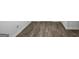 Stylish wood-look floors add a touch of modern design and easy maintenance to the home at 390 River Walk Farm Parkway Lot 47, Covington, GA 30014