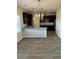 Open kitchen featuring a large island and pendant lighting at 390 River Walk Farm Parkway Lot 47, Covington, GA 30014