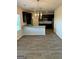 Open-concept kitchen featuring a breakfast bar, stainless appliances, and dark cabinetry creating a modern feel at 390 River Walk Farm Parkway Lot 47, Covington, GA 30014