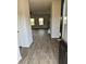 View of an open-concept living area with luxury vinyl flooring from the entry at 390 River Walk Farm Parkway Lot 47, Covington, GA 30014