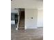 Carpeted staircase with iron railing in a home with luxury vinyl plank flooring at 390 River Walk Farm Parkway Lot 47, Covington, GA 30014