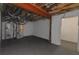 Unfinished basement featuring exposed ducts and utilities, offering potential for customization and expansion at 6048 Golf View Xing, Locust Grove, GA 30248