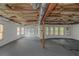 Large, unfinished basement featuring multiple windows for natural light at 6048 Golf View Xing, Locust Grove, GA 30248