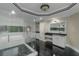 Primary bath with glass shower, soaking tub, dual vanities and marble floors at 6048 Golf View Xing, Locust Grove, GA 30248