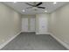 Well-lit bedroom featuring recessed lighting, a ceiling fan, and multiple closet doors for ample storage at 6048 Golf View Xing, Locust Grove, GA 30248
