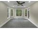 Bright and airy bedroom featuring large windows offering natural light and a pleasant view at 6048 Golf View Xing, Locust Grove, GA 30248