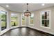 Bright breakfast nook with large windows and a modern chandelier at 6048 Golf View Xing, Locust Grove, GA 30248