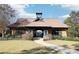 Charming community clubhouse with well-manicured lawn and inviting walkway, perfect for social gatherings at 6048 Golf View Xing, Locust Grove, GA 30248