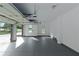 Attached garage with white walls and gray flooring, ready for vehicles and storage at 6048 Golf View Xing, Locust Grove, GA 30248
