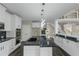 Modern kitchen with granite countertops, stainless steel appliances, and a large island at 6048 Golf View Xing, Locust Grove, GA 30248