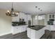 Contemporary kitchen with granite countertops, stainless steel appliances, and pendant lighting at 6048 Golf View Xing, Locust Grove, GA 30248