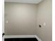 A compact laundry area, ready for customization, with a dark floor and neutral walls at 6048 Golf View Xing, Locust Grove, GA 30248