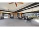 The outdoor patio is covered and includes multiple ceiling fans and tables with chairs at 6048 Golf View Xing, Locust Grove, GA 30248