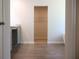Bathroom leading to walk-in closet, featuring tile floor and vanity at 663 Egrets Landing Lot #55, Covington, GA 30014