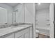 Stylish bathroom features granite countertops, a tub with shower, and white cabinets at 663 Egrets Landing Lot #55, Covington, GA 30014