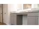 Modern bathroom vanity with double sinks, granite countertops, and ample cabinet space at 663 Egrets Landing Lot #55, Covington, GA 30014