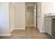 A neutral colored bathroom showcases tile flooring leading to the hallway and the toilet area at 663 Egrets Landing Lot #55, Covington, GA 30014