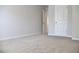 Inviting carpeted bedroom with neutral tones and doorways at 663 Egrets Landing Lot #55, Covington, GA 30014