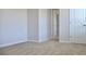 Spacious carpeted bedroom with neutral tones and doorway at 663 Egrets Landing Lot #55, Covington, GA 30014