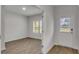 View into the home showcasing the floors, an entry door, and a window overlooking the front yard at 663 Egrets Landing Lot #55, Covington, GA 30014
