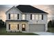 Charming two-story home with gray brick, black shutters, covered front porch, and a two car garage at 663 Egrets Landing Lot #55, Covington, GA 30014