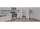 Well-equipped kitchen showcasing stainless steel appliances, pantry, and breakfast bar at 663 Egrets Landing Lot #55, Covington, GA 30014