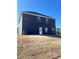 Exterior of new home with blue siding and large backyard at 669 Egrets Lot 56 Lndg, Covington, GA 30014