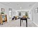 Spacious bonus room with a foosball table, seating, and an adjacent bedroom for flexible living at 669 Egrets Lot 56 Lndg, Covington, GA 30014