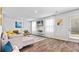 Comfortable living room with lots of natural light, stylish furniture, a fireplace and wood flooring at 669 Egrets Lot 56 Lndg, Covington, GA 30014