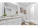 Well-lit bathroom features a white vanity, granite countertop, and a shower with a curtain at 669 Egrets Lot 56 Lndg, Covington, GA 30014