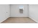Minimalist bedroom design with neutral carpeting and a bright window at 669 Egrets Lot 56 Lndg, Covington, GA 30014