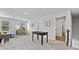 Bright bonus room with natural light, features a foosball table and study space at 669 Egrets Lot 56 Lndg, Covington, GA 30014
